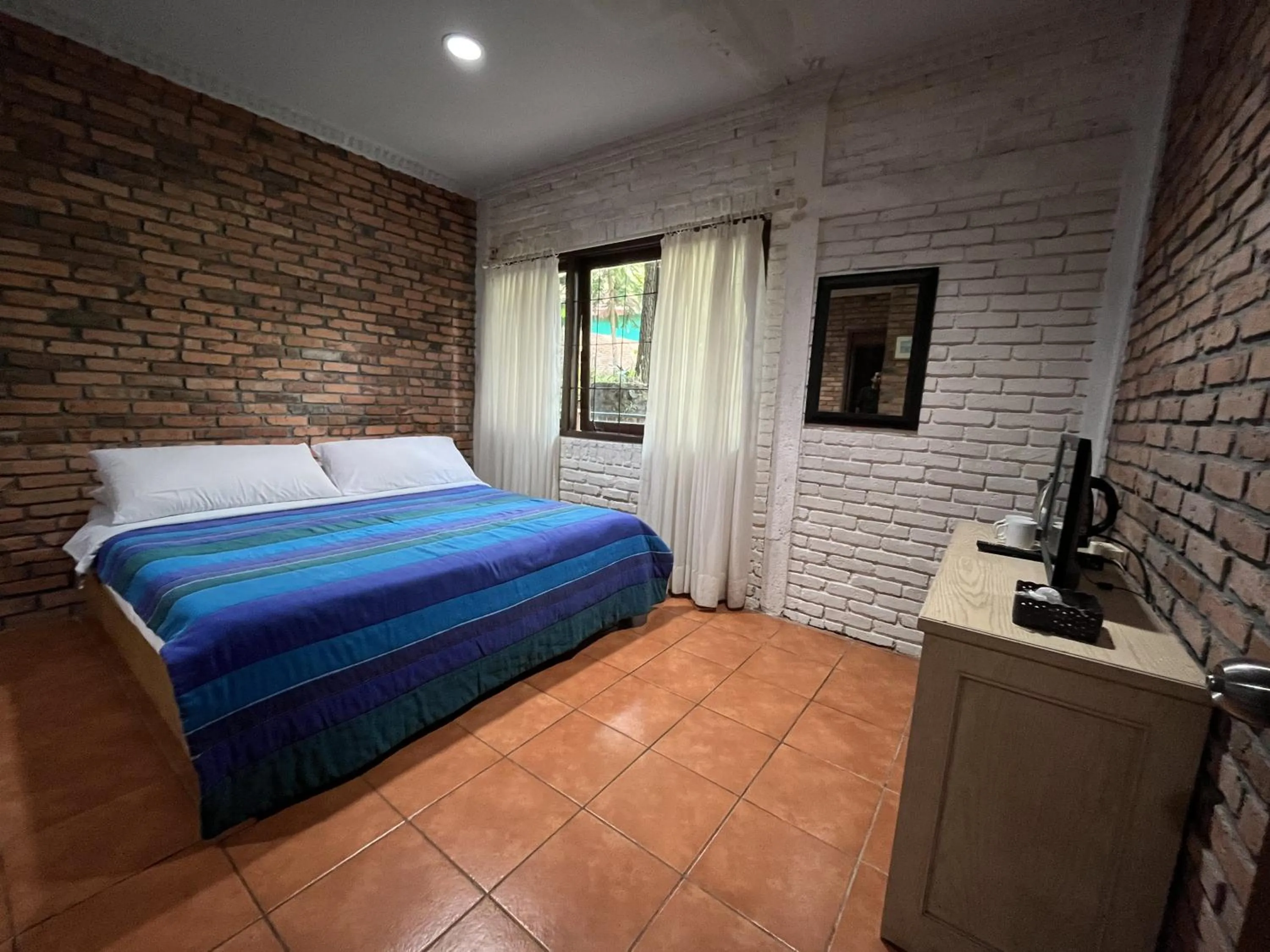 Bed in The Pinewood Lodge and Organic Farm