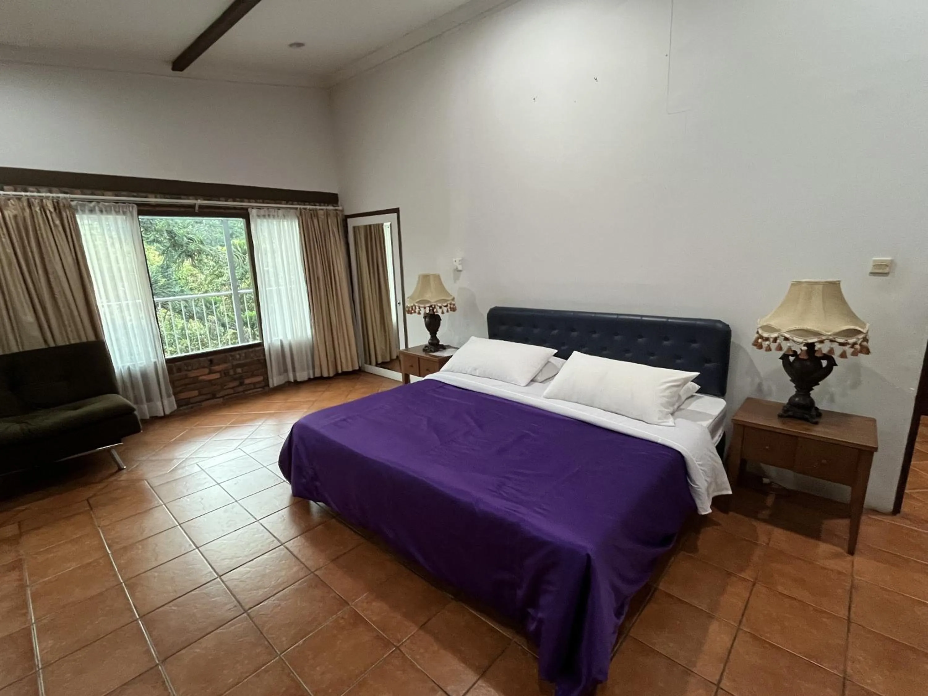 Bed in The Pinewood Lodge and Organic Farm