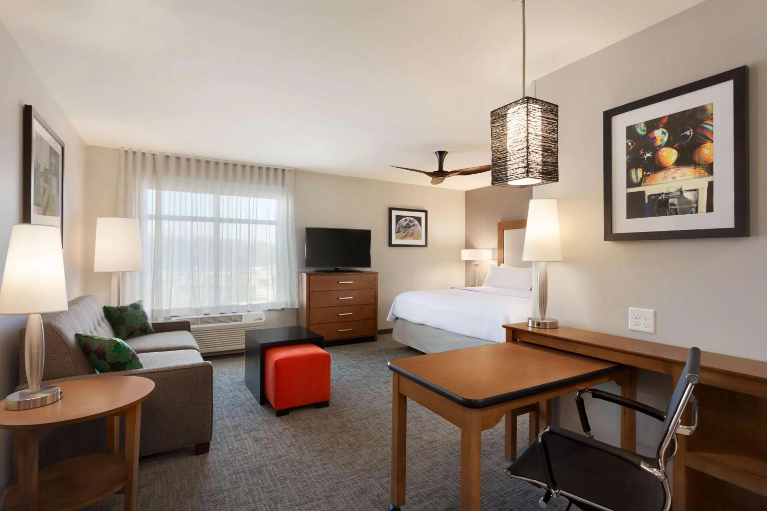 Living room, Bed in Homewood Suites by Hilton Syracuse - Carrier Circle