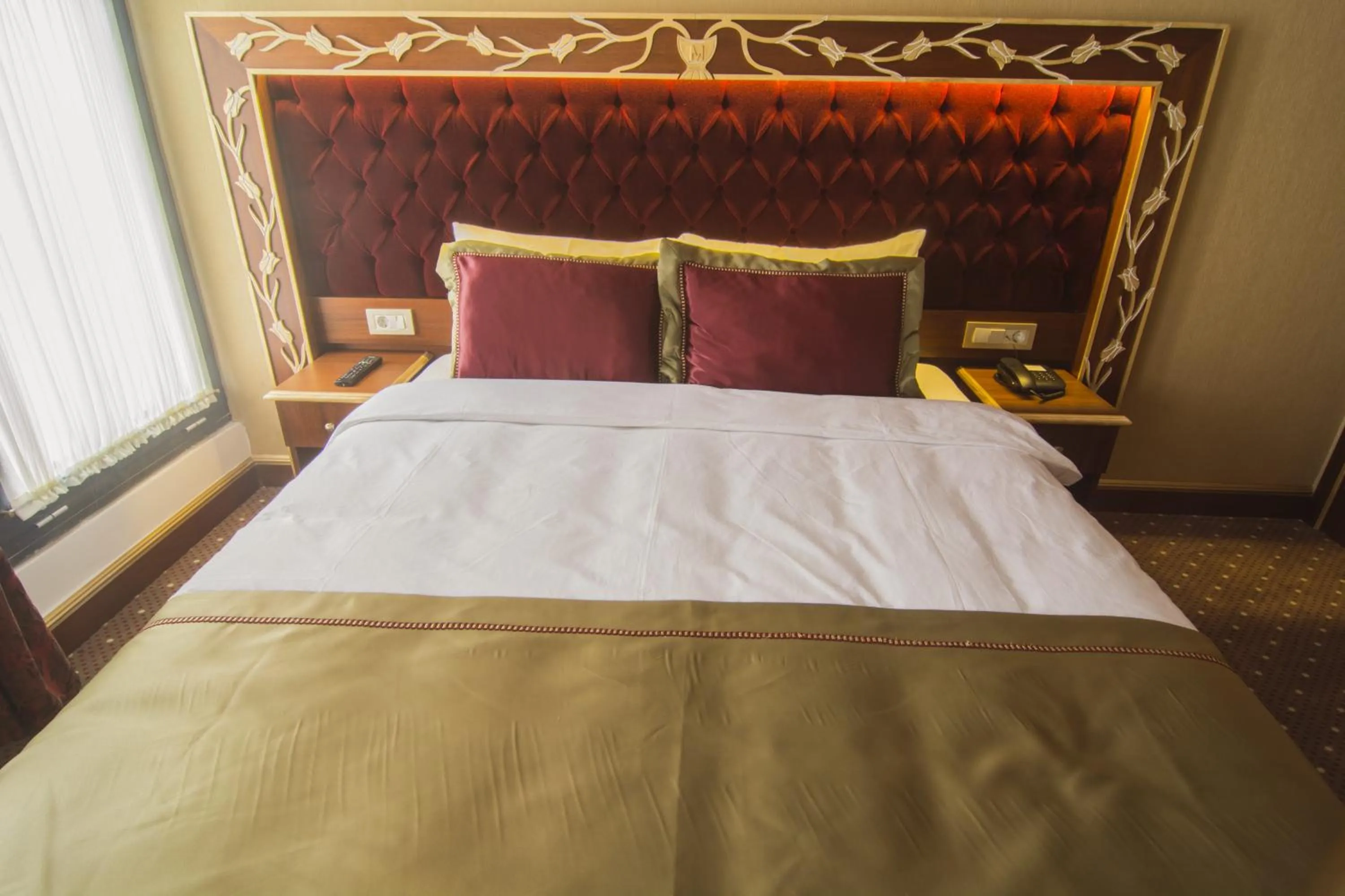Bed in MB Deluxe Hotel