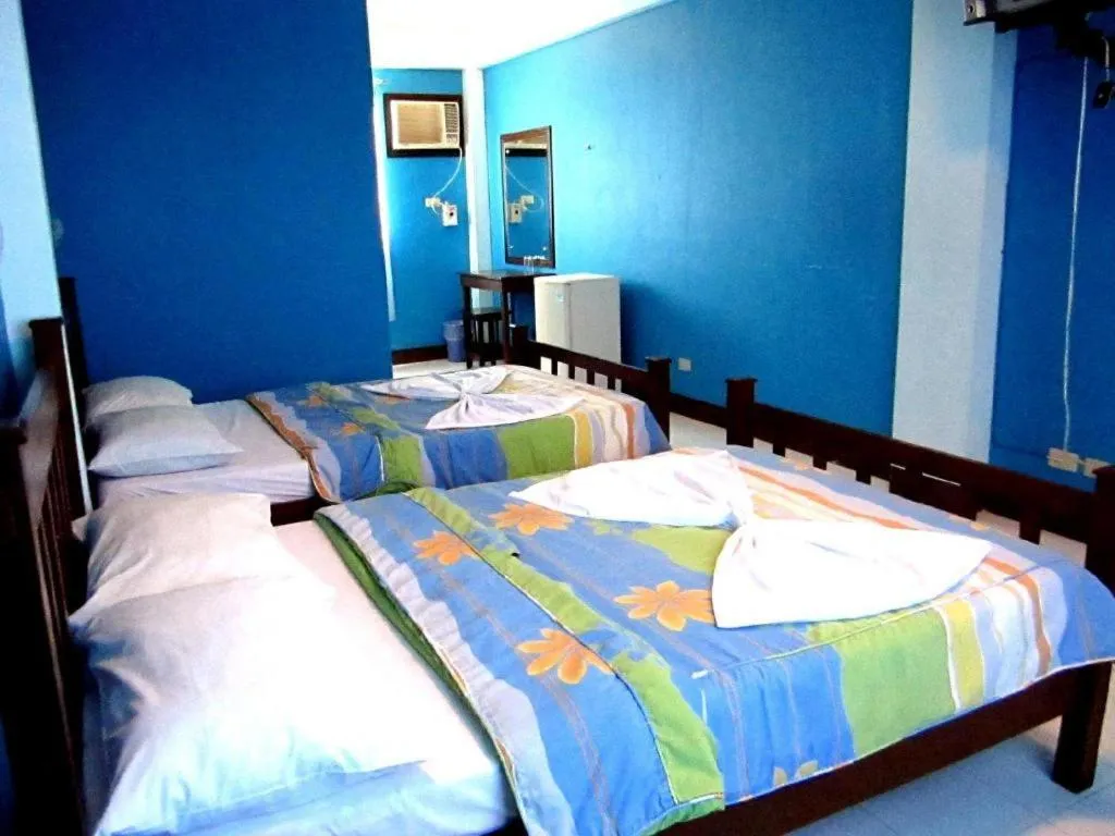 Bed in Tamaraw Beach Resort