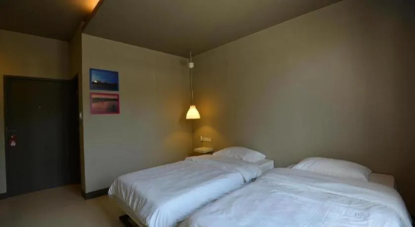 Bed in Sabye D Resort at Surat