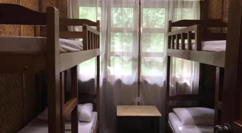 Bed in Sanctuary Garden Resort