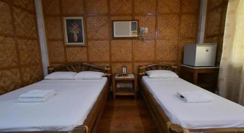 Bed in Sanctuary Garden Resort