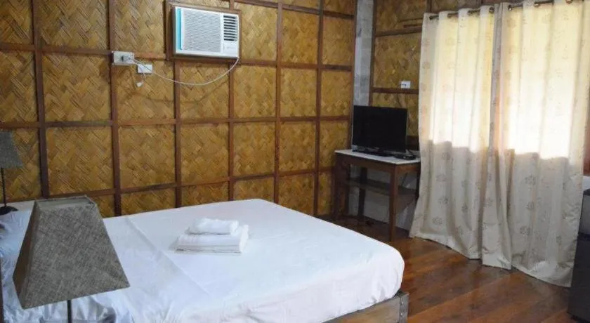 Bed in Sanctuary Garden Resort
