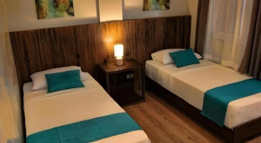 Bed in Batis Aramin Resort And Hotel Corp.