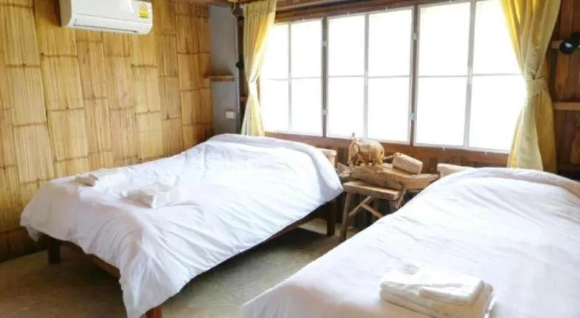 Bed in Maan Mek Talay Mok Resort