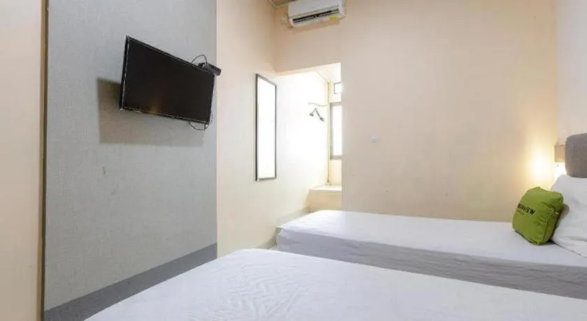 Bed in Urbanview Hotel Delima 101 Syariah