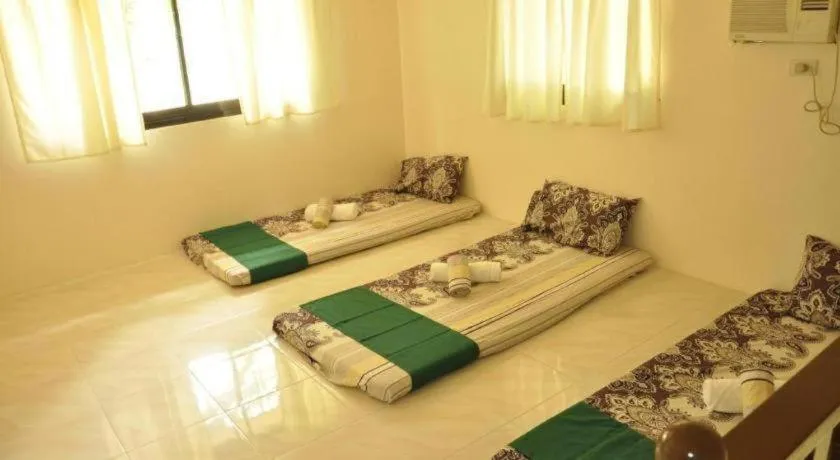 Bed in Paseo Verde Beach Resort