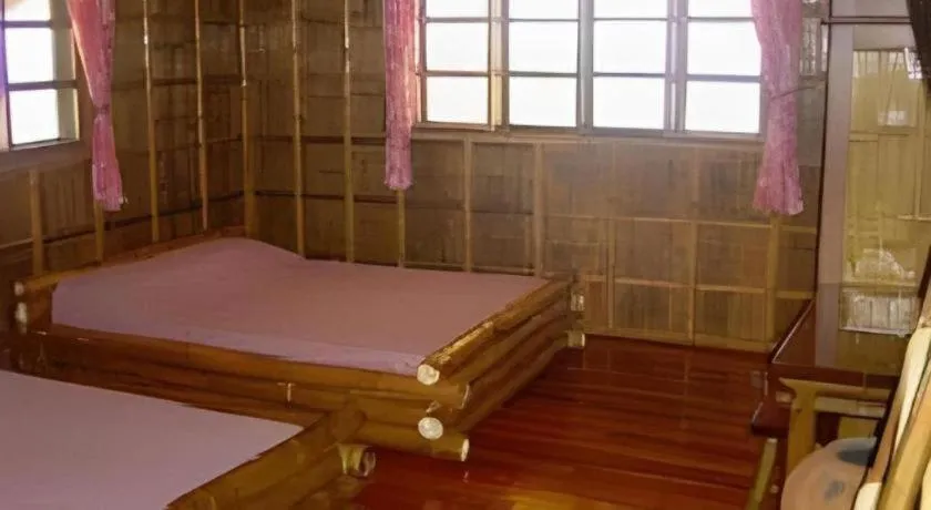 Bed in Nataasan Beach Resort and Dive Center