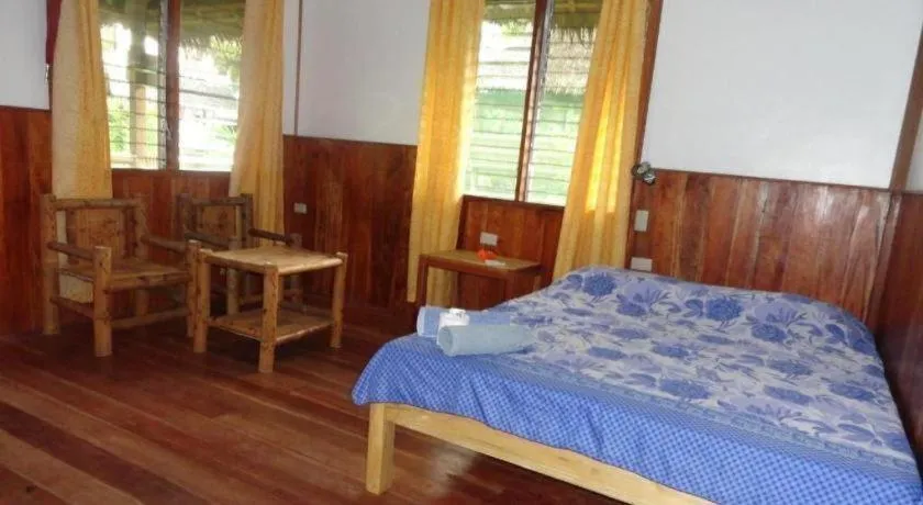 Bed in Mayas Native Garden Resort