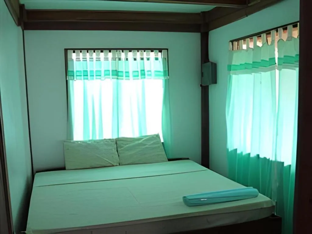 Bed in Mayas Native Garden Resort
