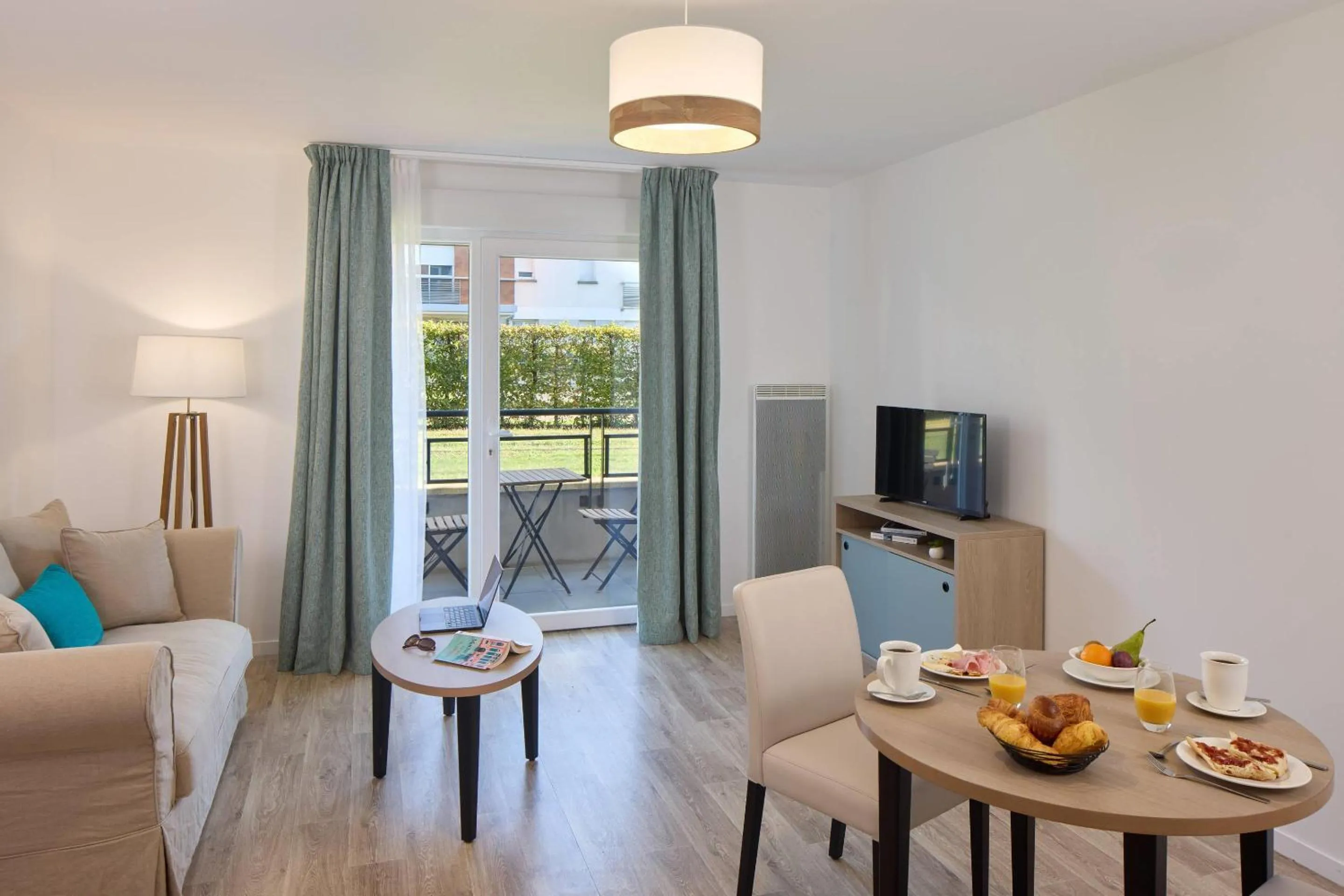 Communal lounge/ TV room in Quality Aparthotel Orleans Sud Zenith