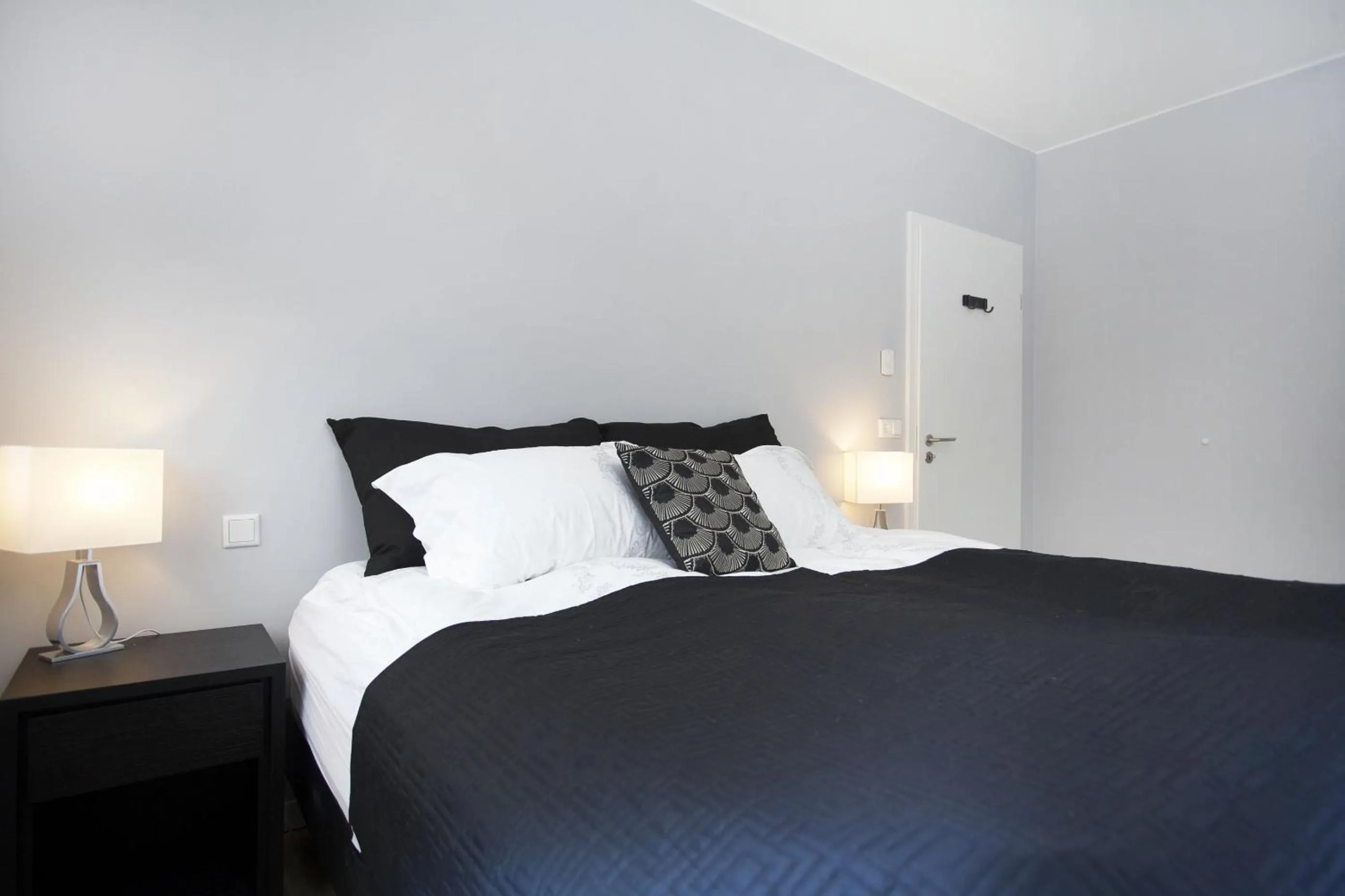 Bed in Blue Luxury Apartments