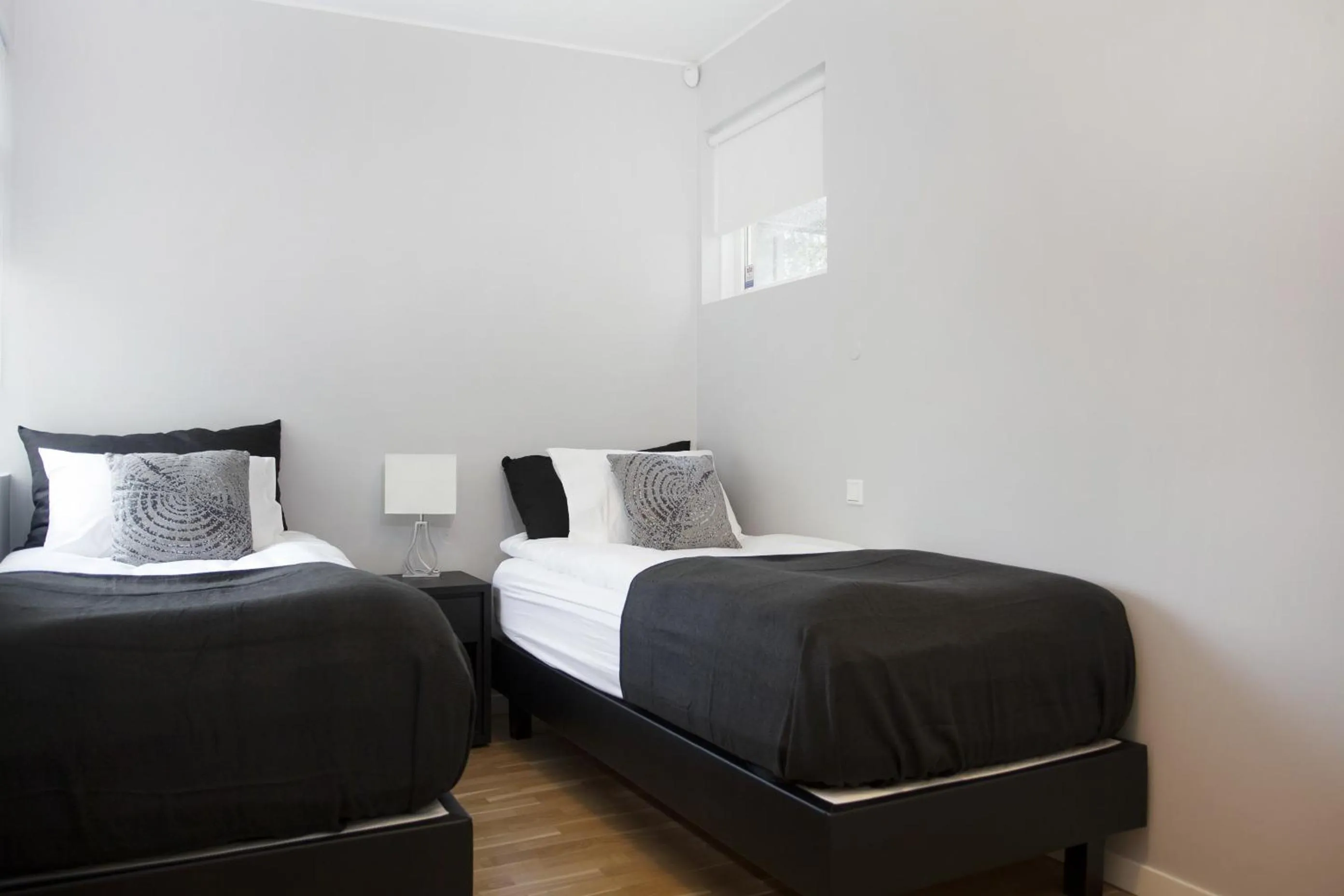 Bed in Blue Luxury Apartments