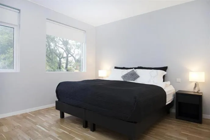 Bed in Blue Luxury Apartments