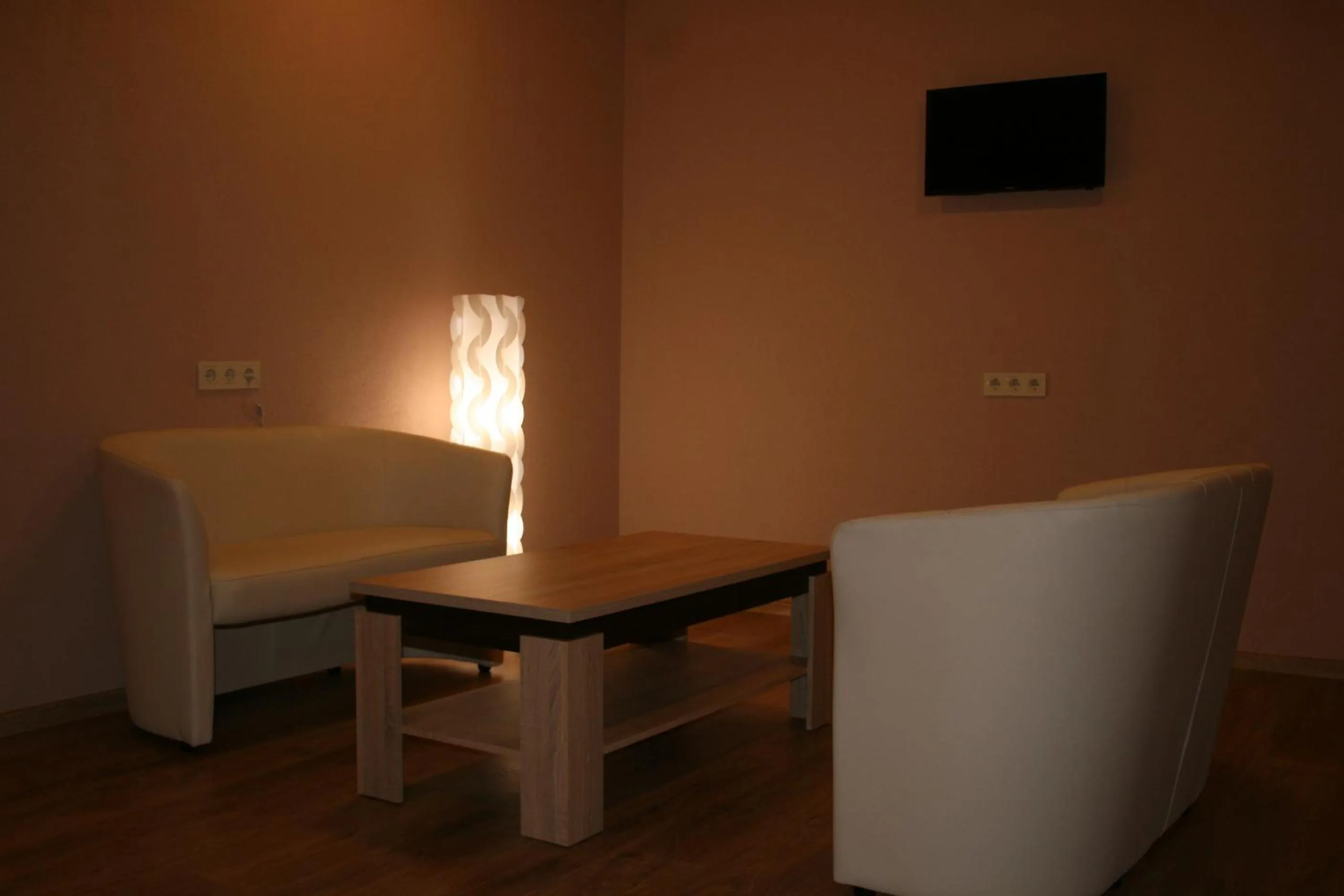 Communal lounge/ TV room in Bella Riga Hotel with Self-Check in