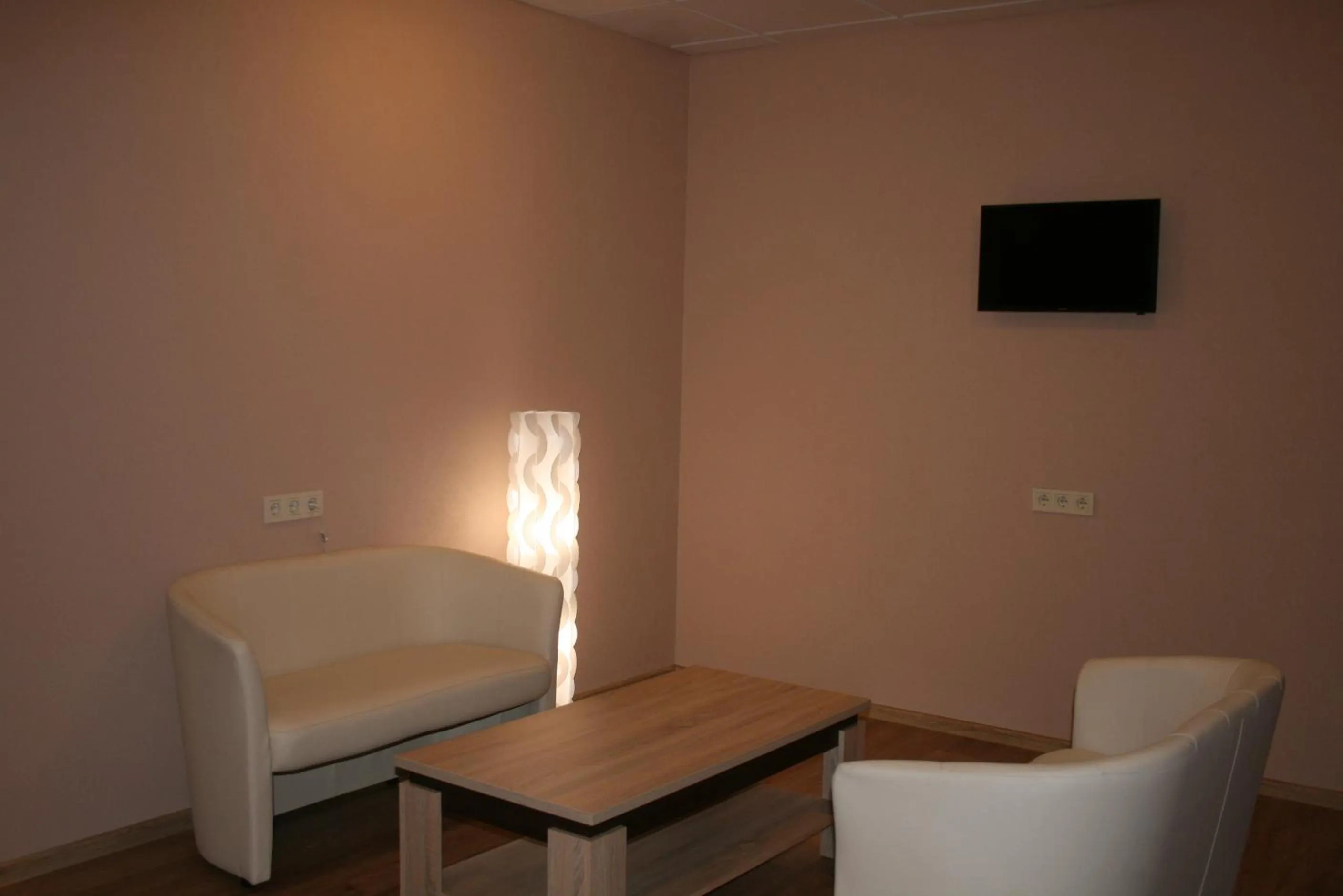 Communal lounge/ TV room in Bella Riga Hotel with Self-Check in