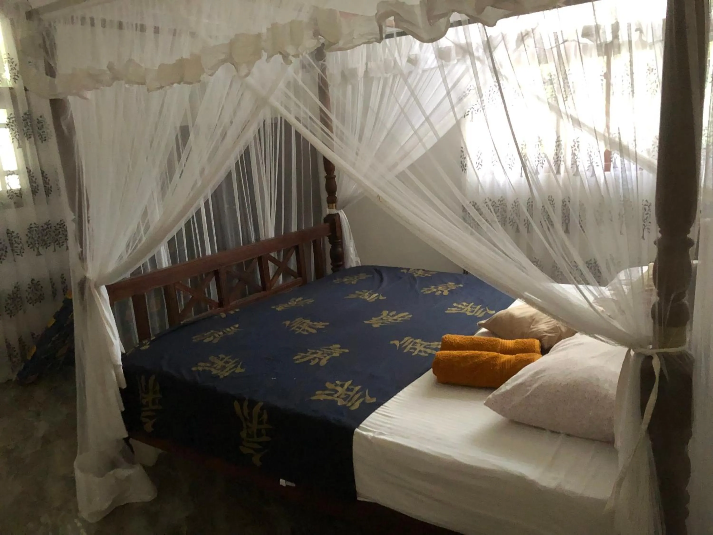 Bed in Coral Palm Villa and Apartment