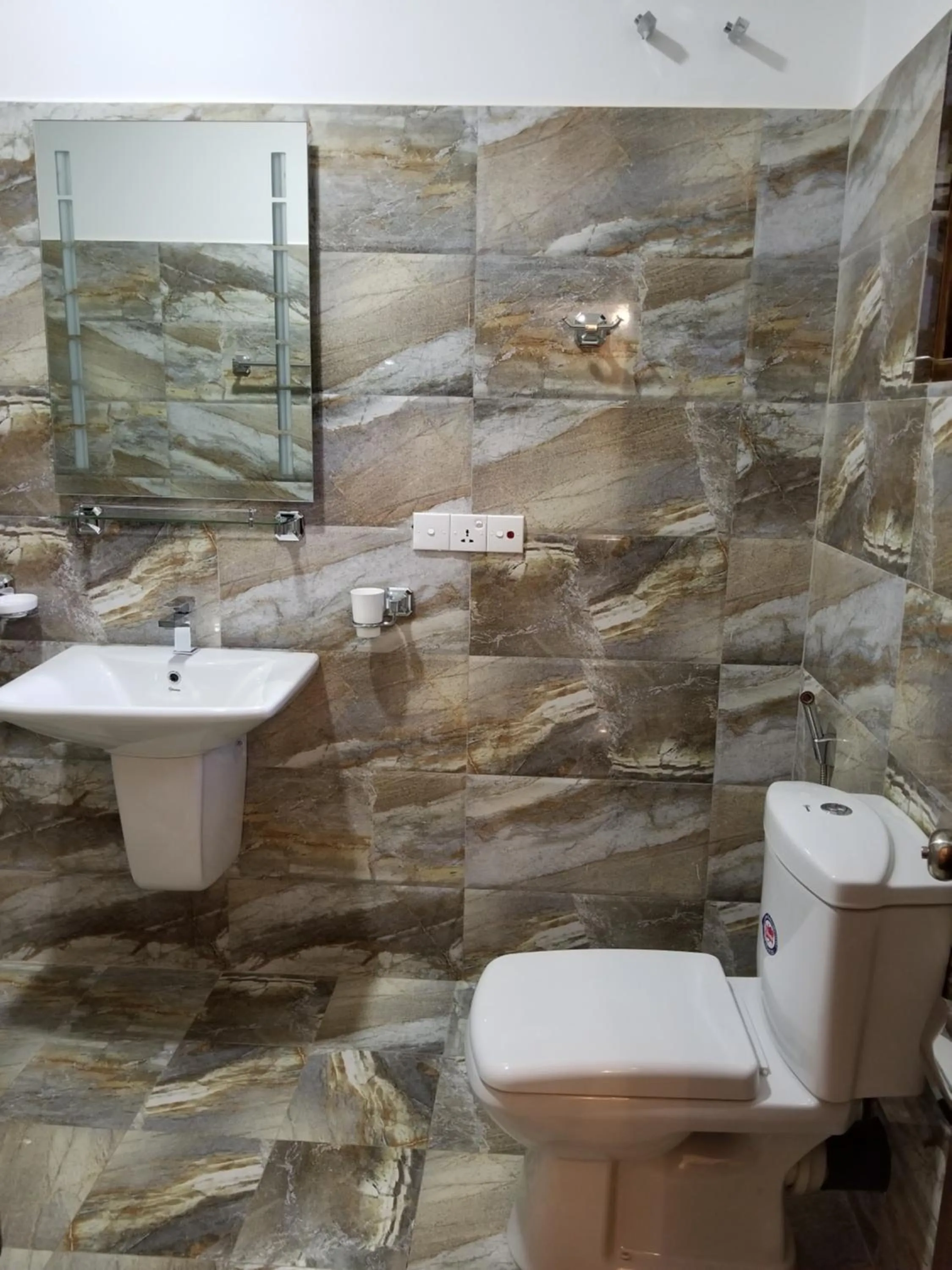 Toilet in Coral Palm Villa and Apartment