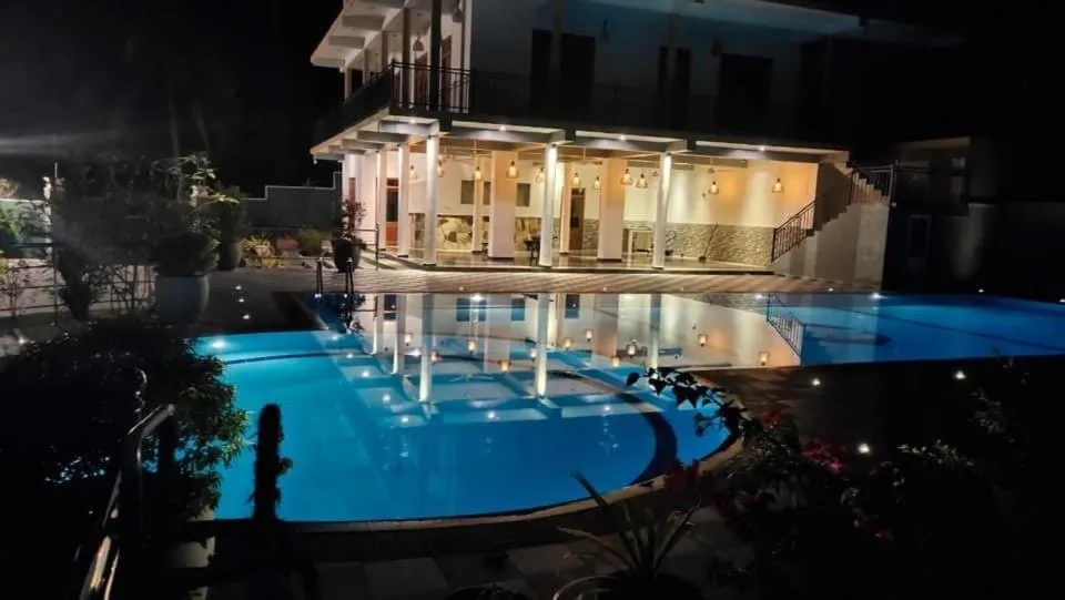 Swimming pool in Coral Palm Villa and Apartment