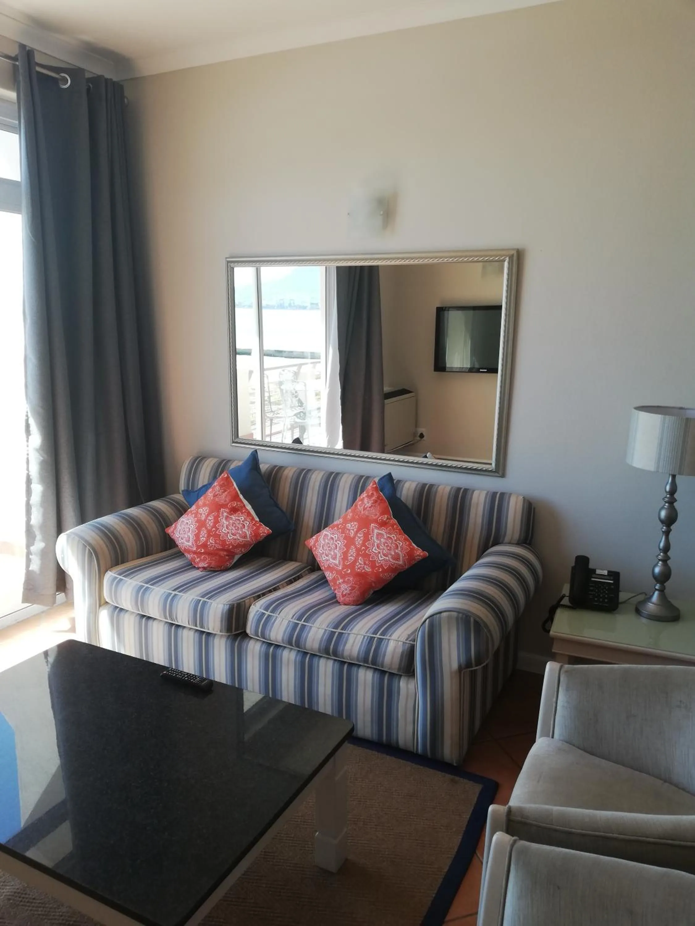 Living room, Bed in Cape Town Beachfront Apartments at Leisure Bay