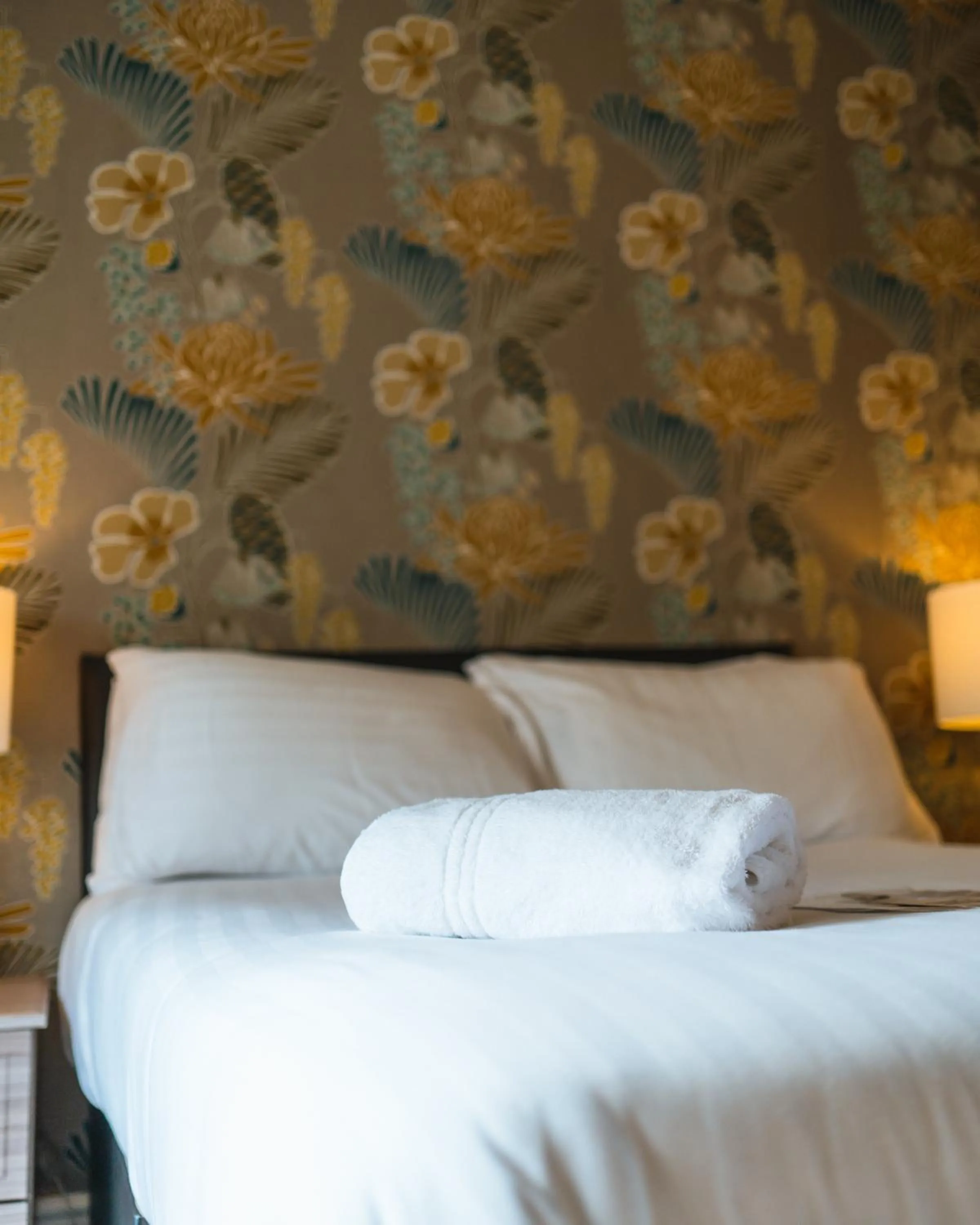 Bed in Johnny Dough's Conwy with Rooms