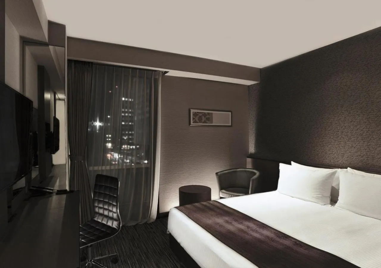 Photo of the whole room, Bed in The Strings Hotel Nagoya