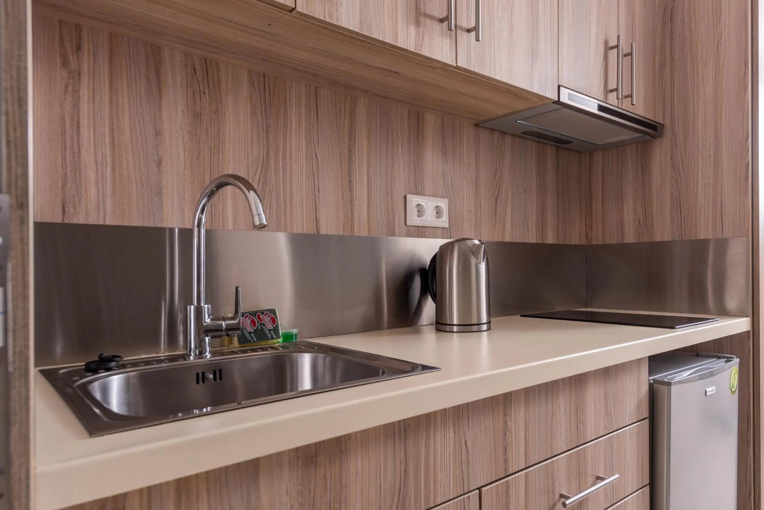 Kitchen or kitchenette in Dionysos Hotel & Suites