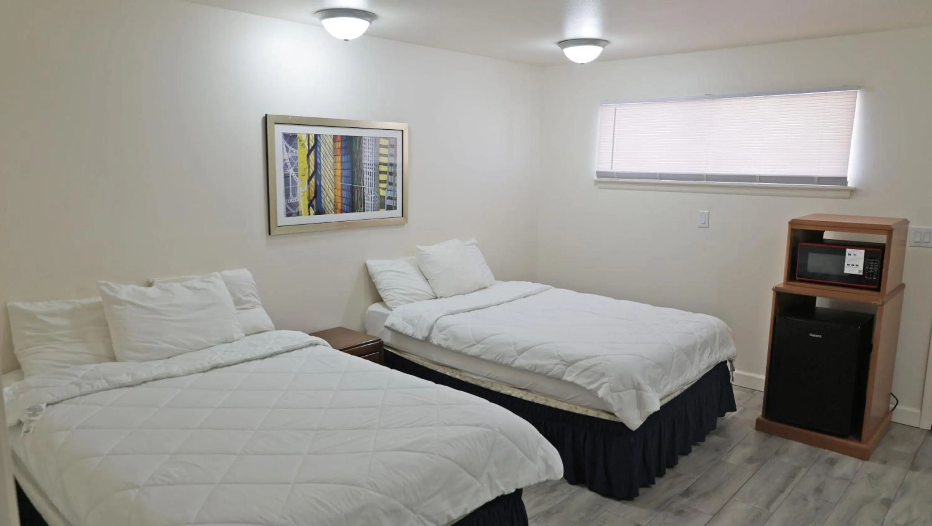 Bed in Sawmill Lodges Motel