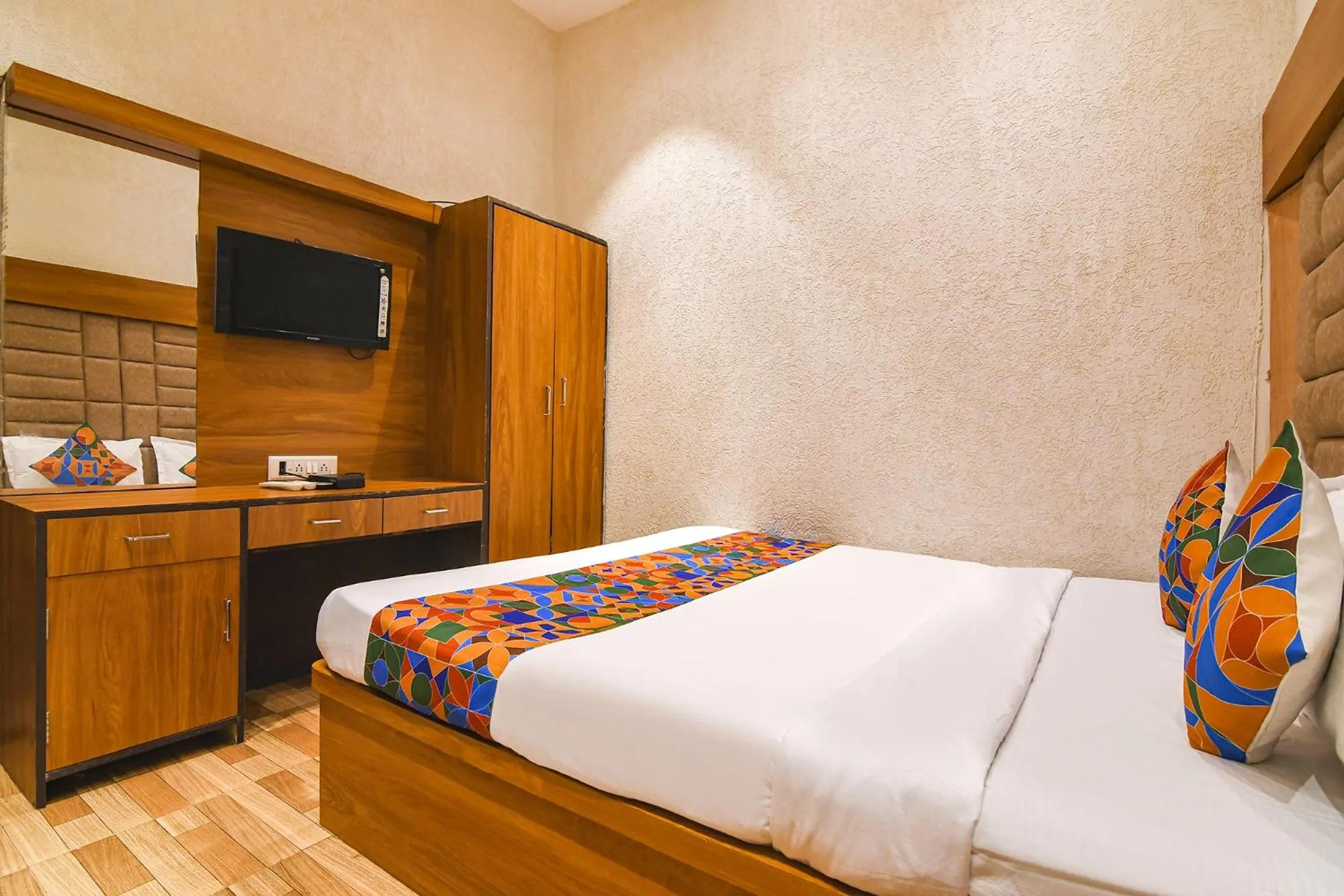 Bed in FabHotel Marina