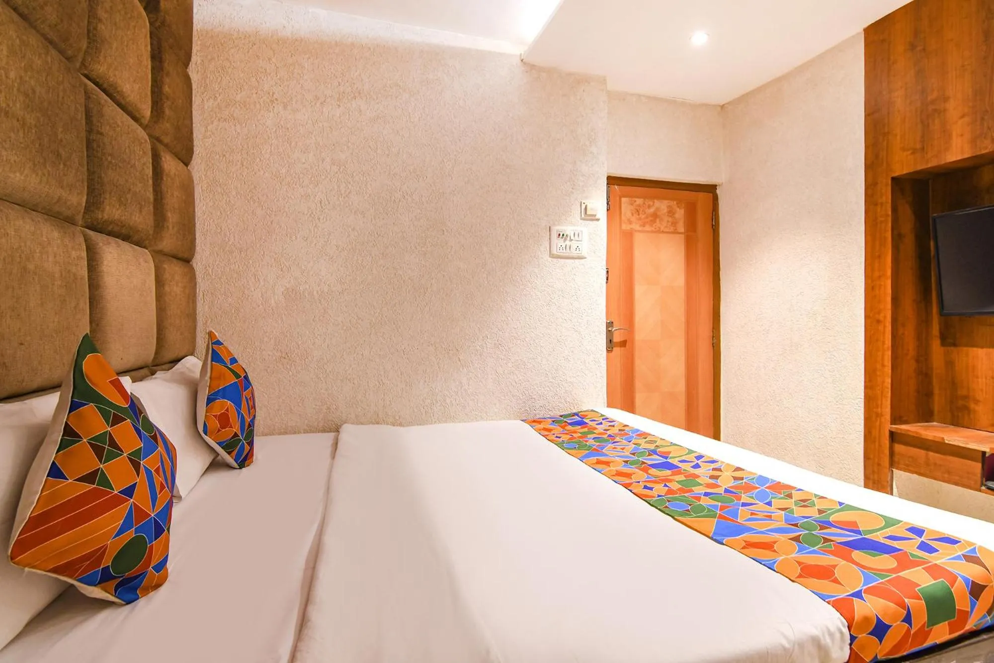 Bed in FabHotel Marina