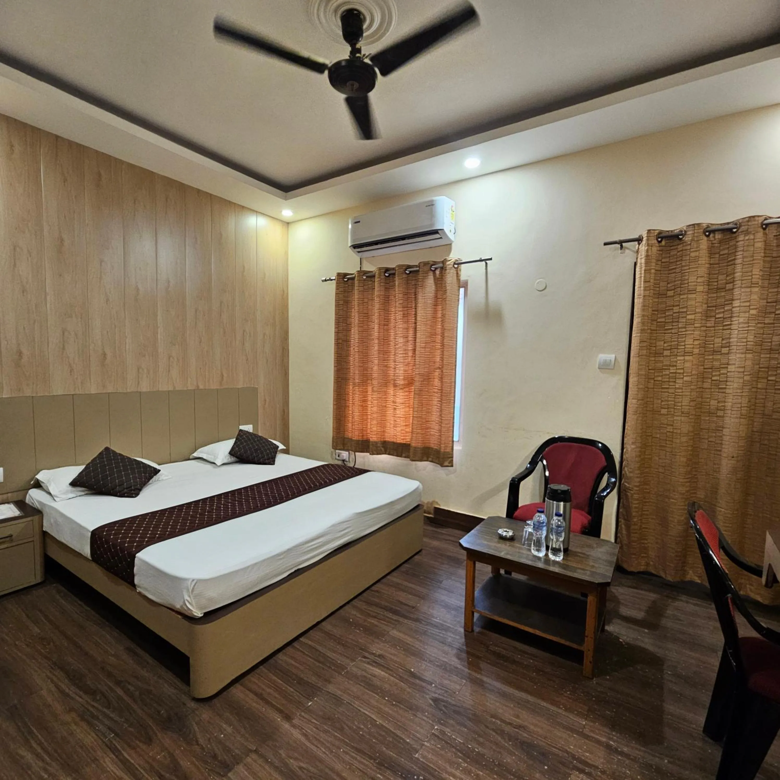 Bed in Hotel Padmini International- Sigra