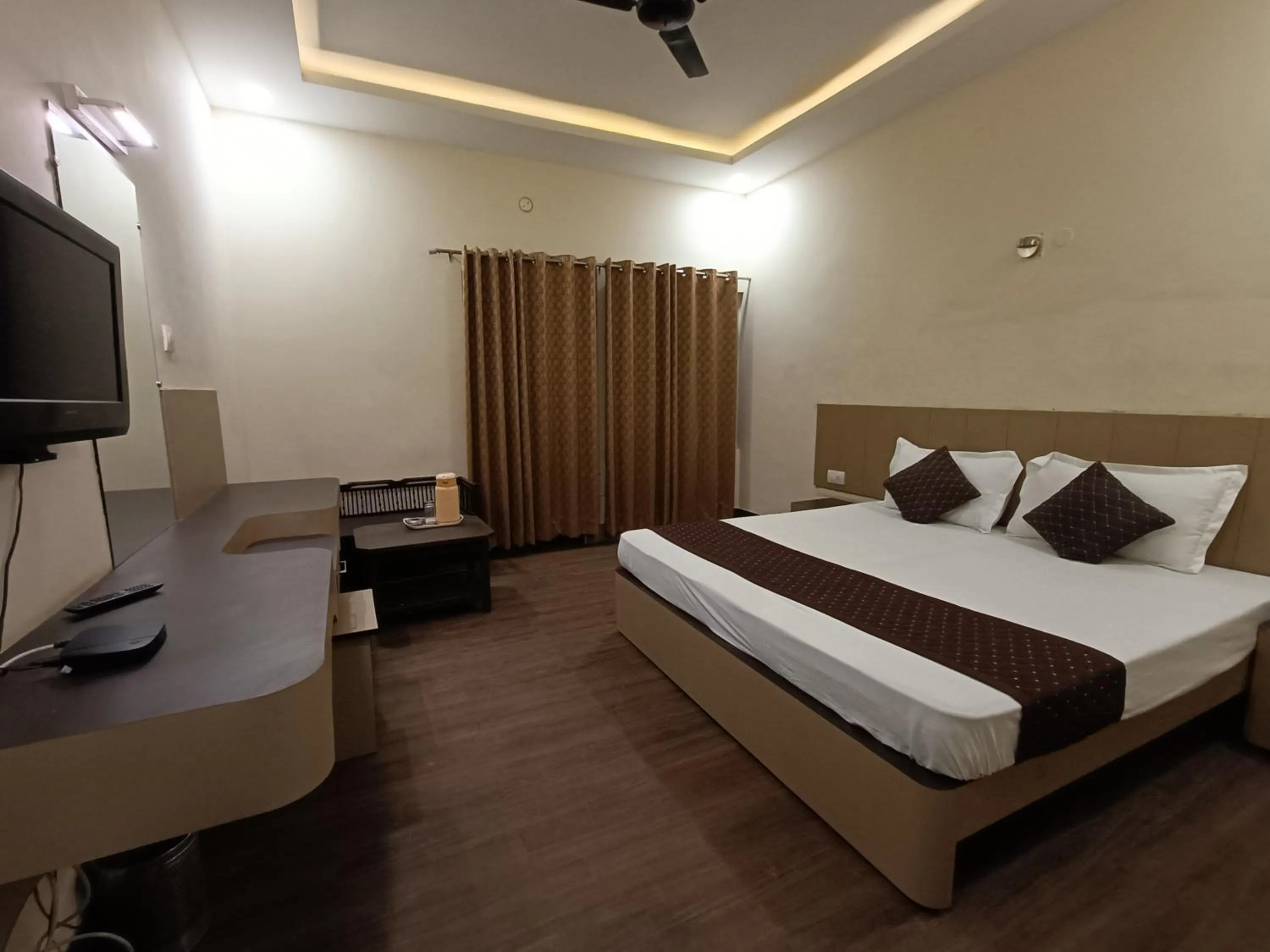 Bed in Hotel Padmini International- Sigra