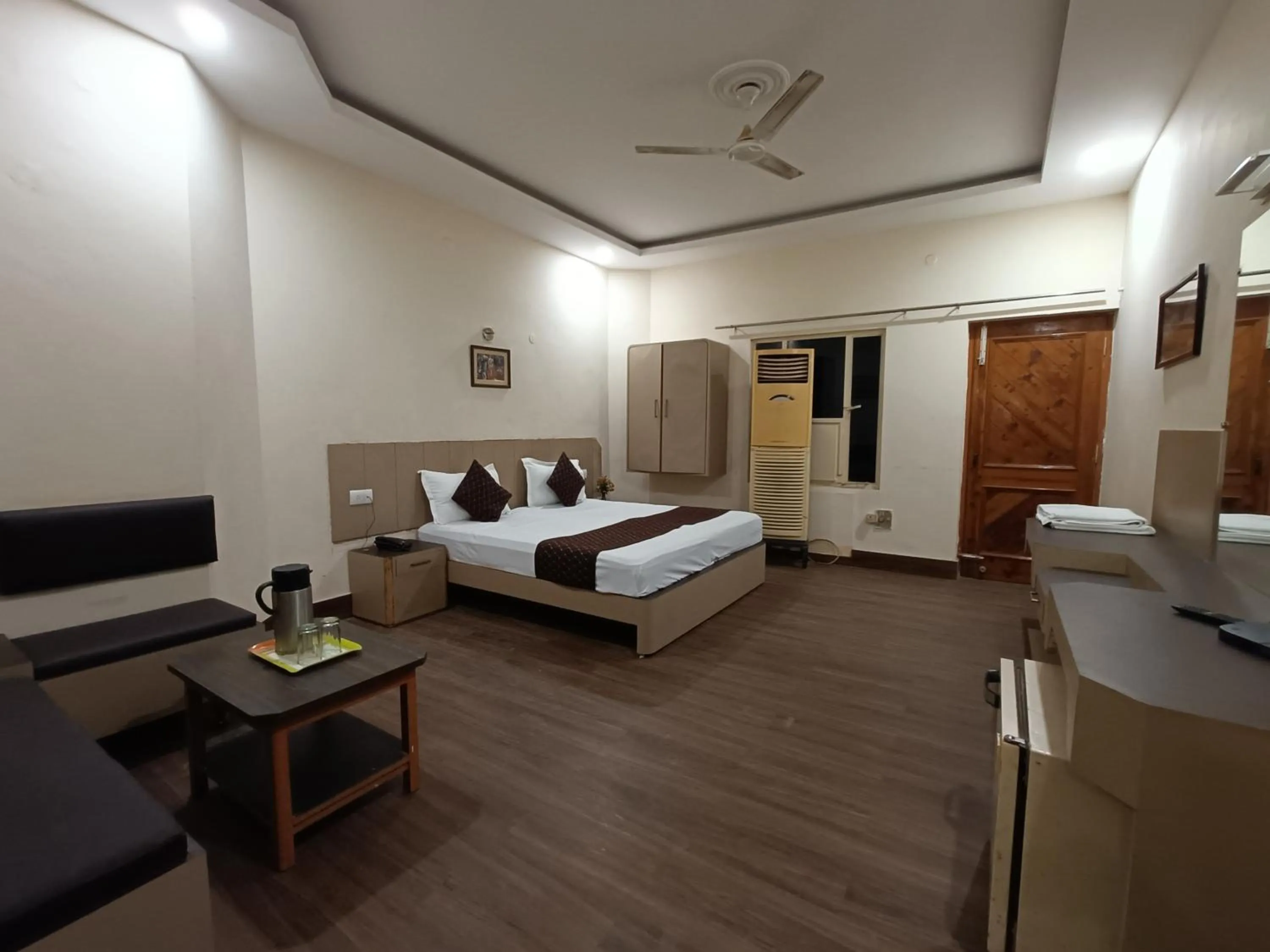 Bed in Hotel Padmini International- Sigra