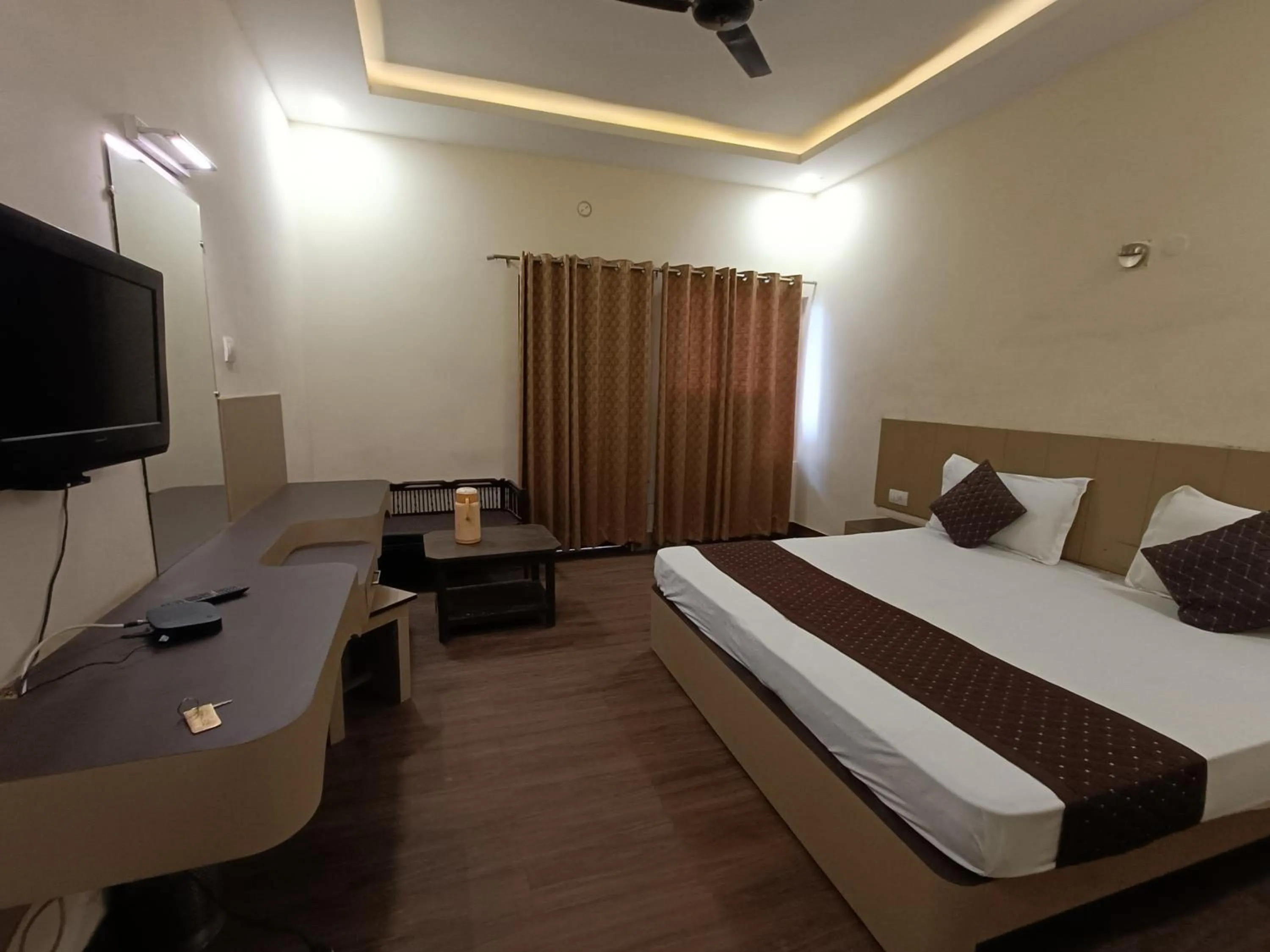 Bed in Hotel Padmini International- Sigra