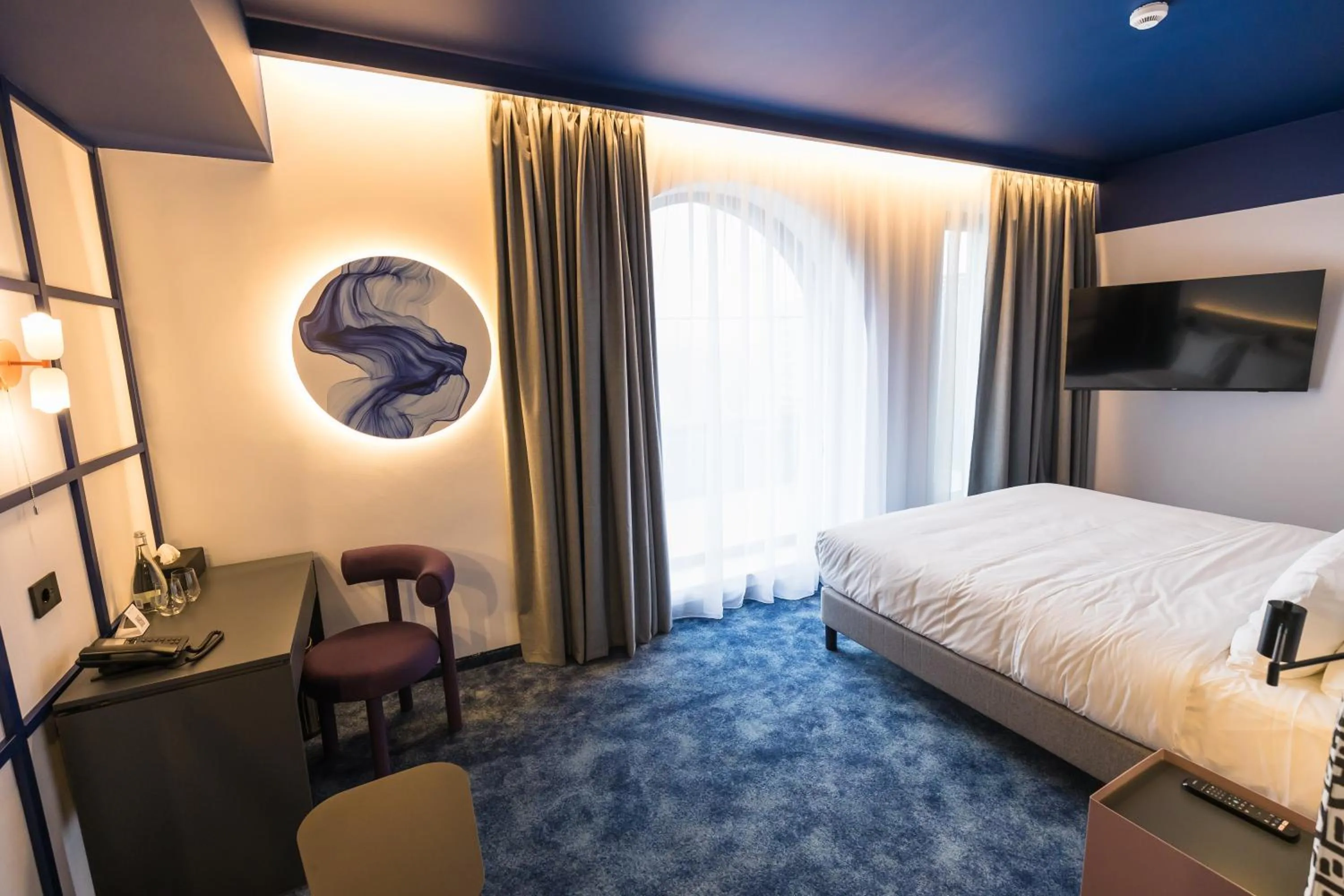 Bed in Mercure Bucharest Cantemir