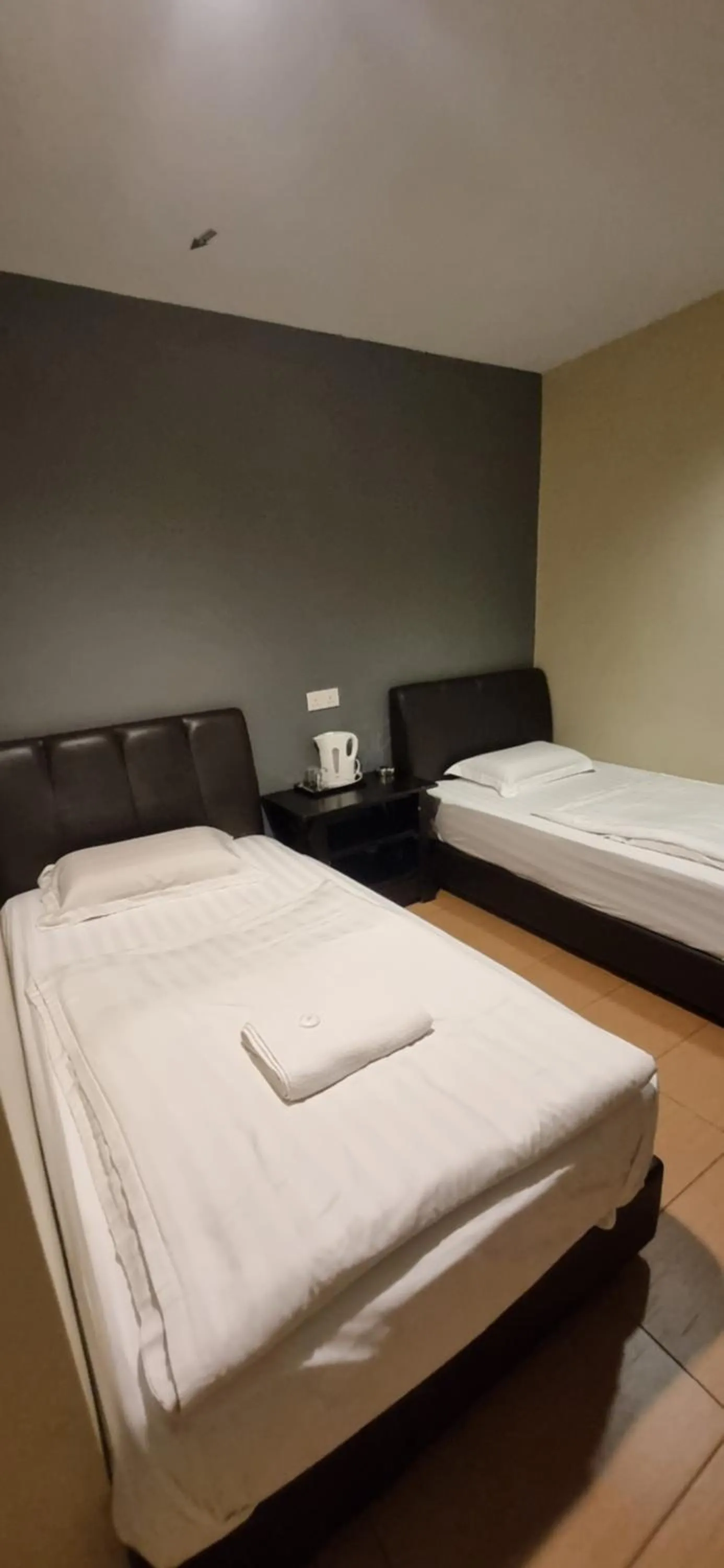 Bed in Tas Sakura Budget Hotel