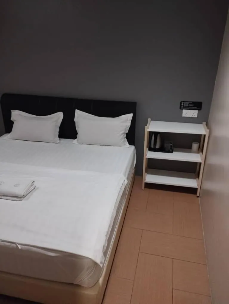 Bed in Tas Sakura Budget Hotel