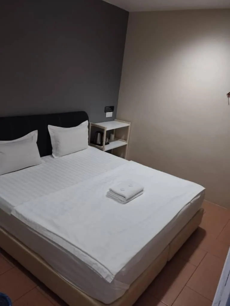 Bed in Tas Sakura Budget Hotel