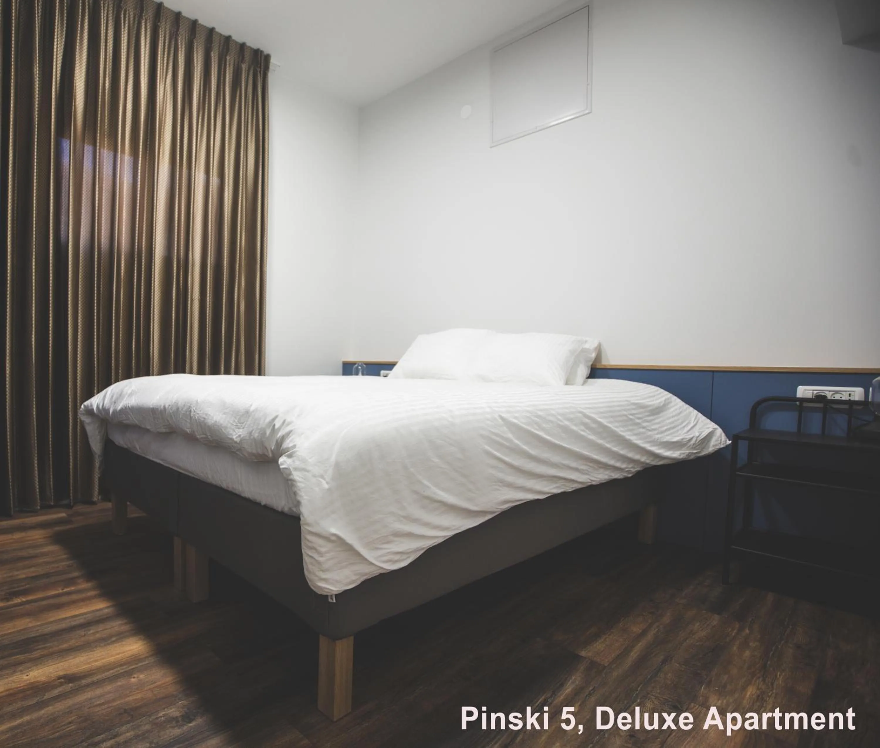 Bed in Carmel Boutique Apartments