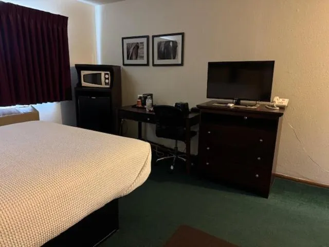 Bed in Heritage Inn Hotel