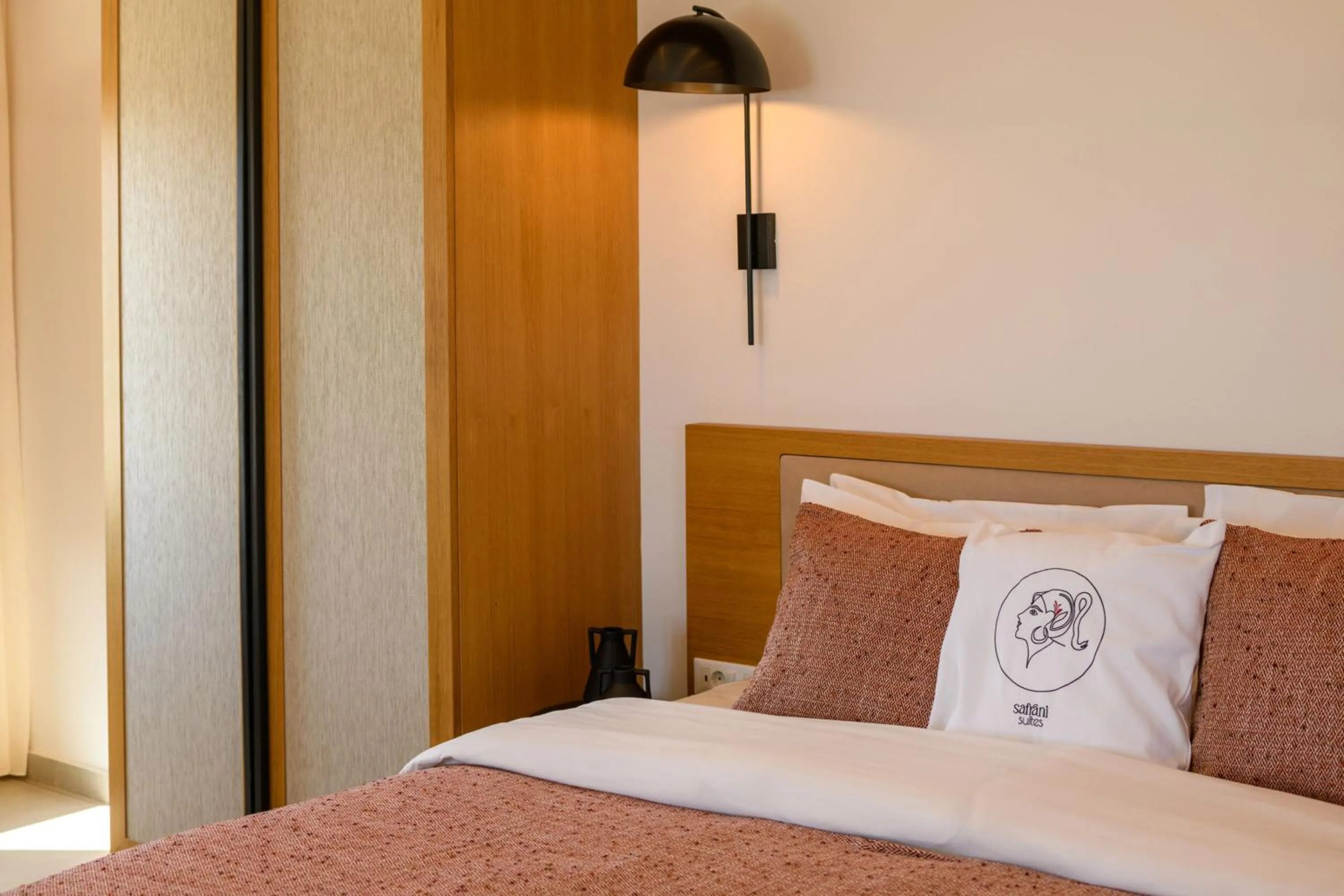 Bed in Safrani Suites