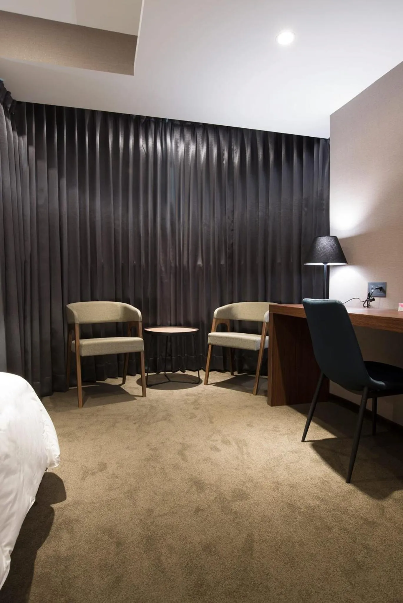 Seating area, Bed in Noble Hotel