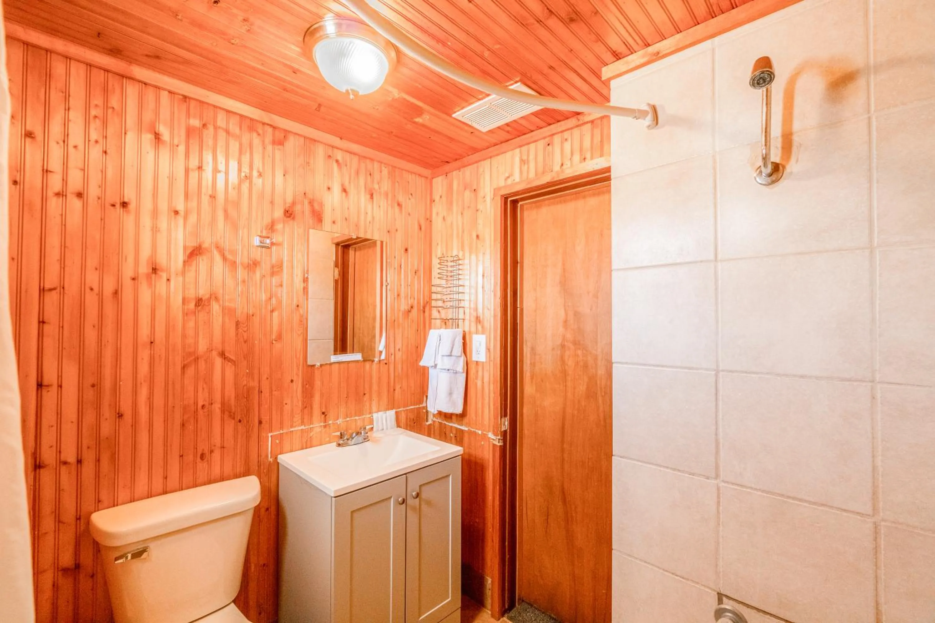 Bathroom in Green Acre Motel by OYO Near Rush County Airport