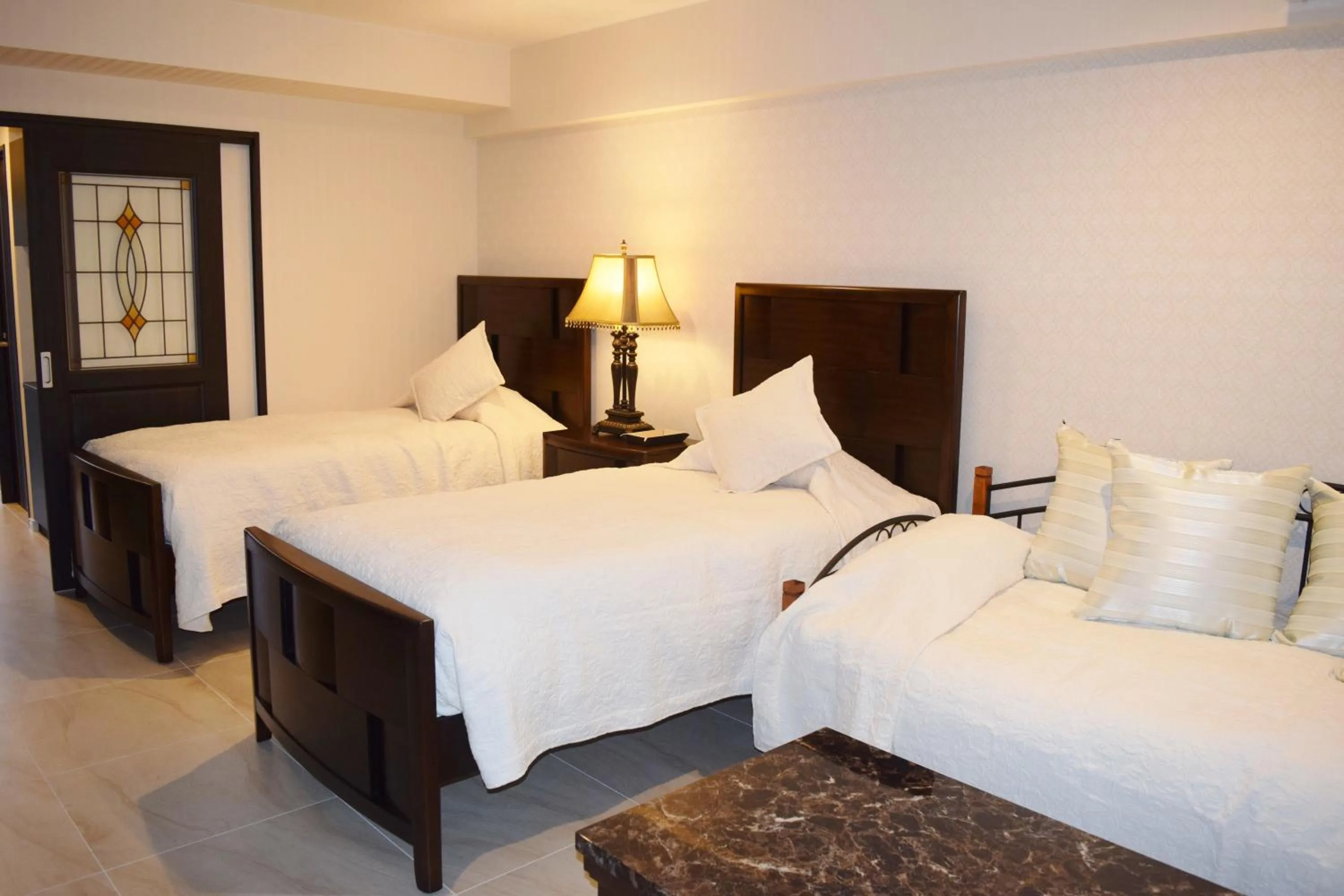 Bed in Wisteria Condominium Resort