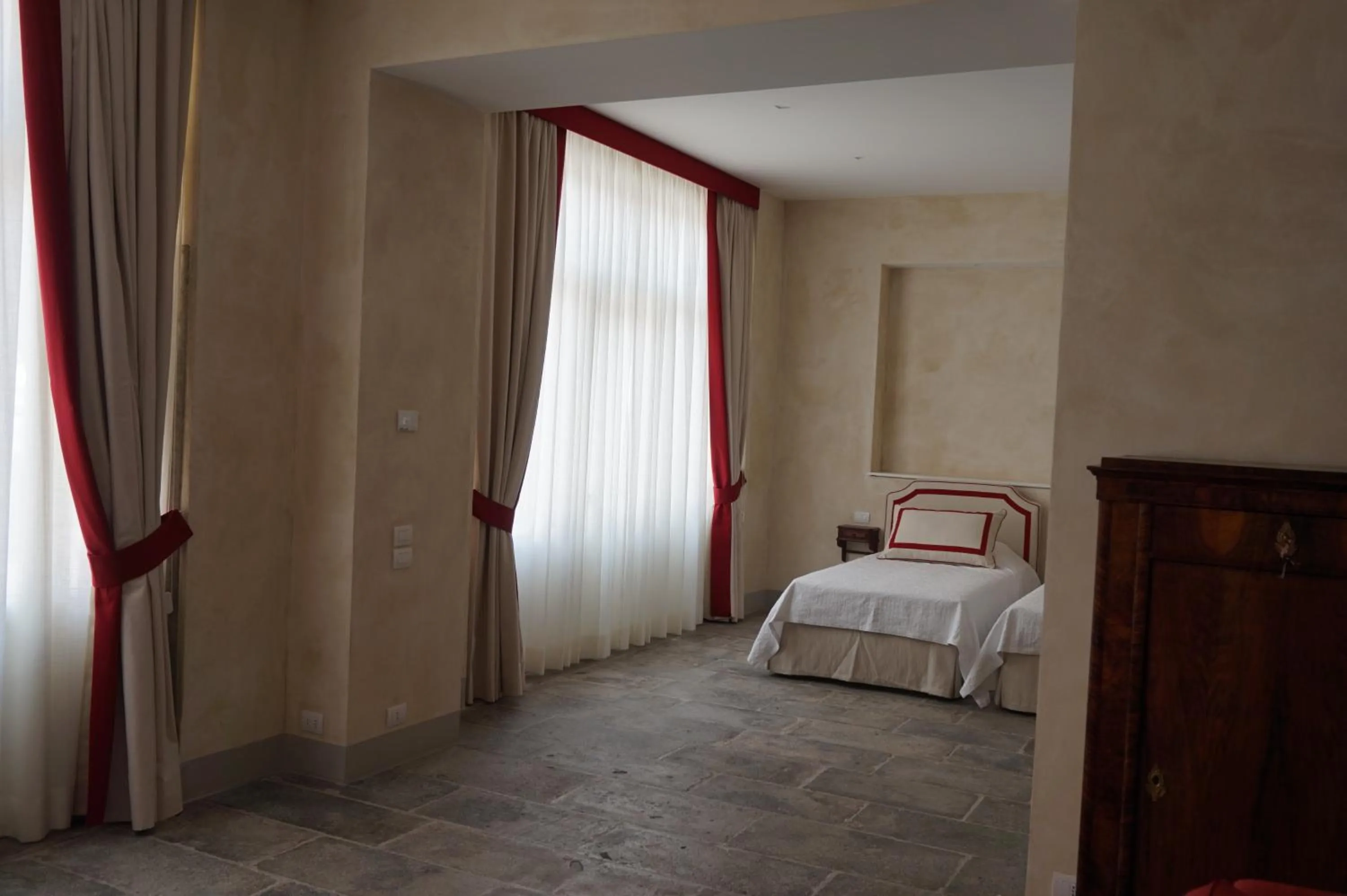 Bed in Palazzo Mantua Benavides Suites & Apartments