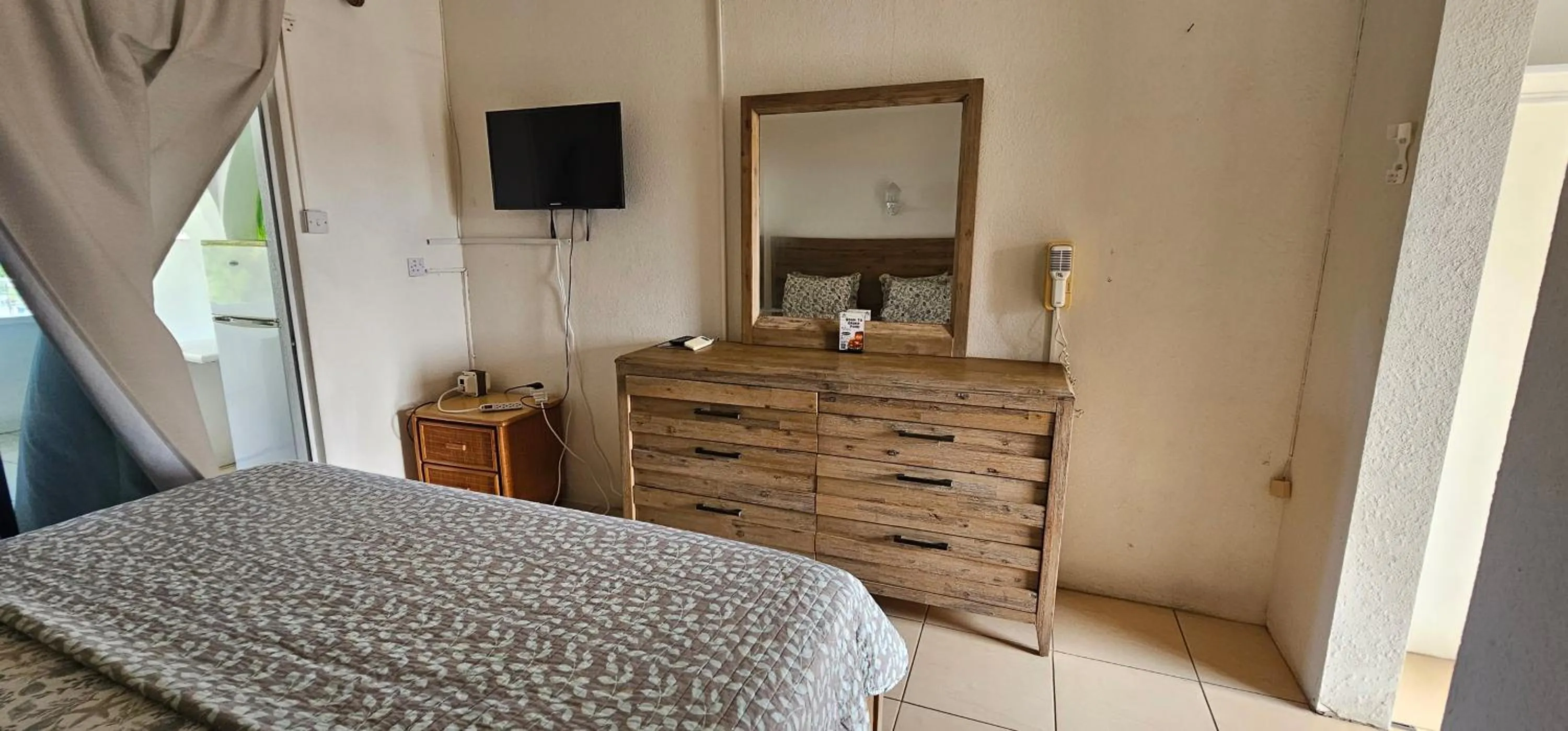 Bed in Wavecrest Suites