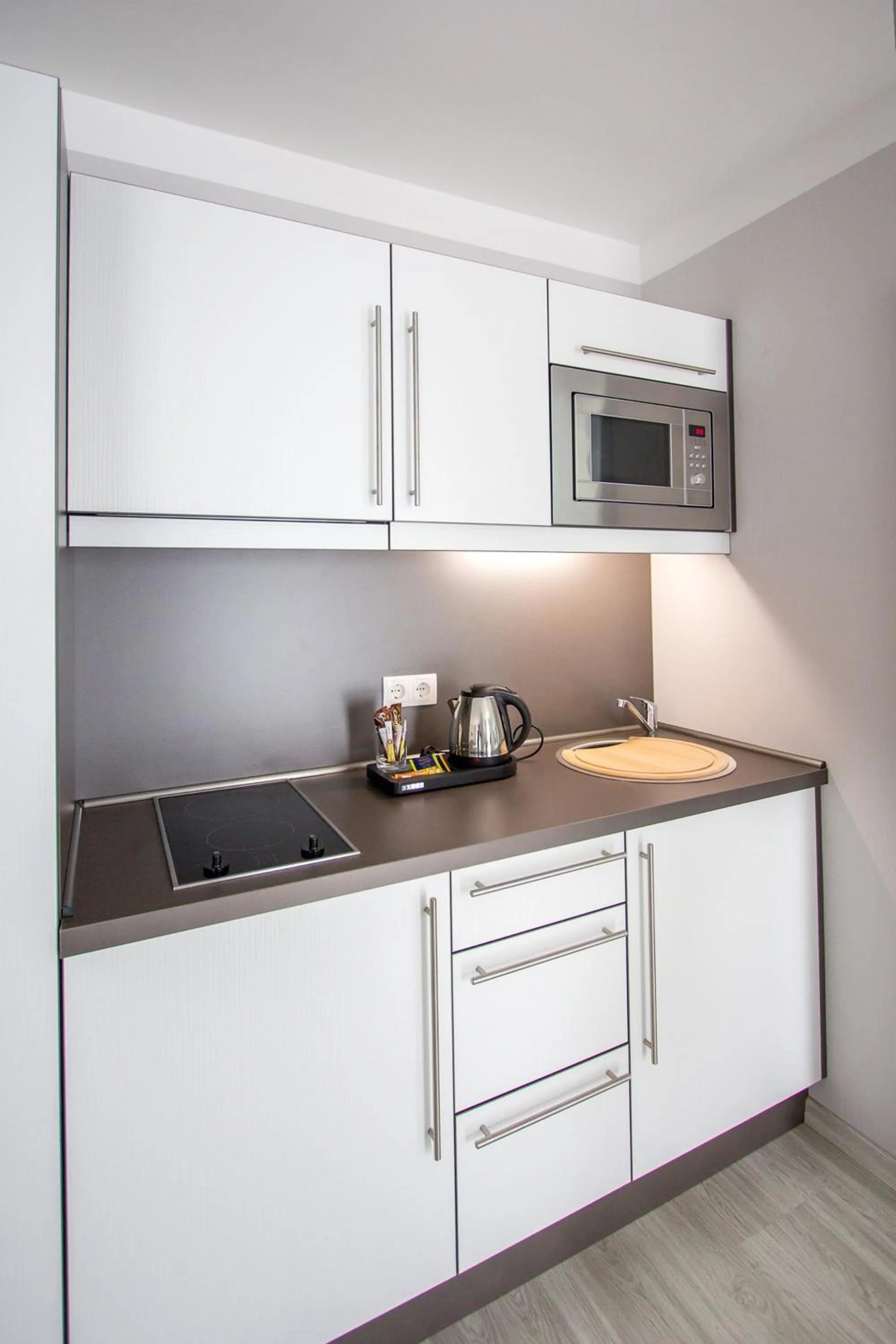 Kitchen or kitchenette in ApartHotel "Am Fließ"