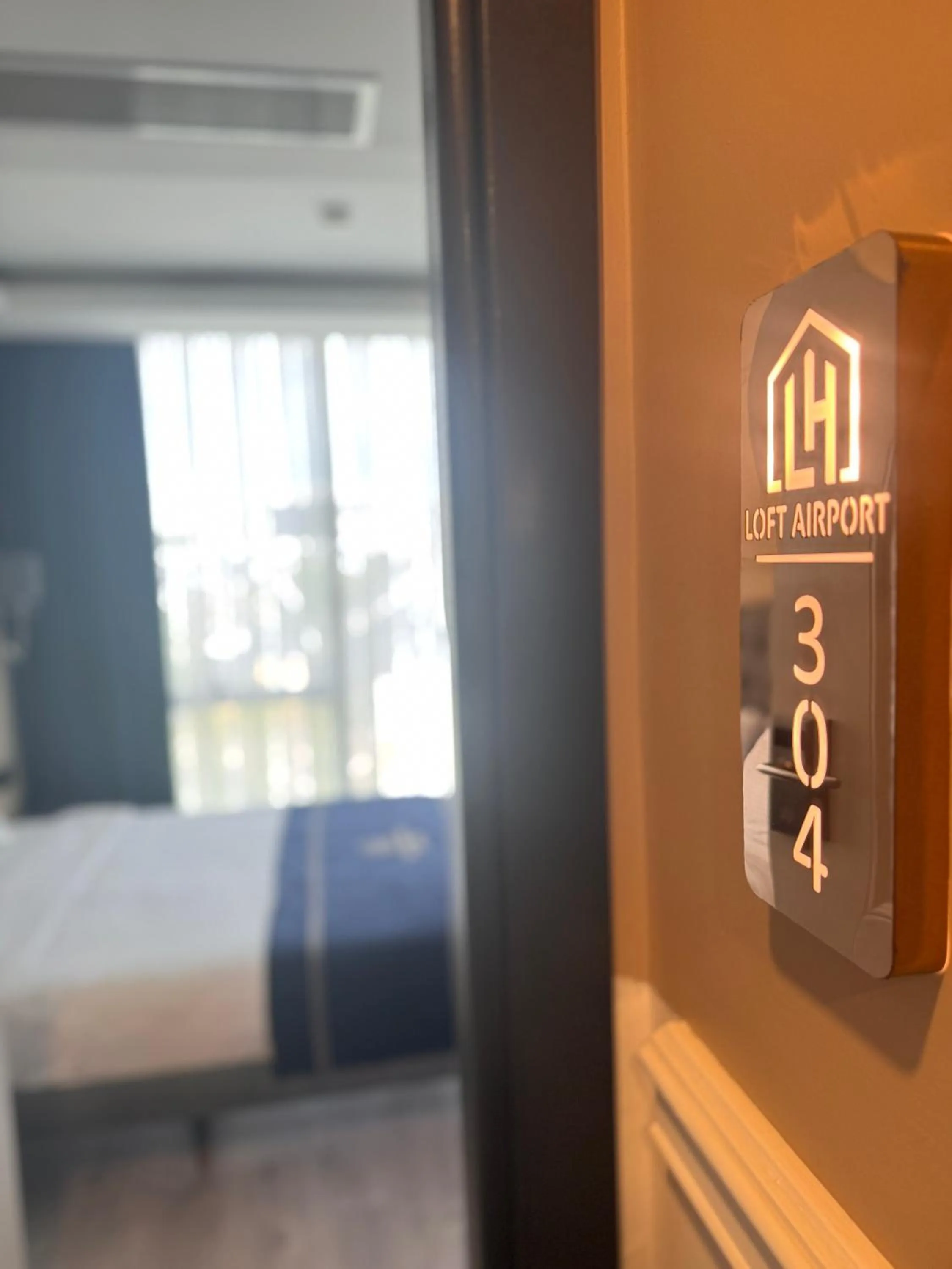 Bed in Loft Airport Hotel